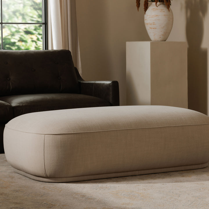 Elevate Living: Curvaceous Performance-Fabric Ottoman