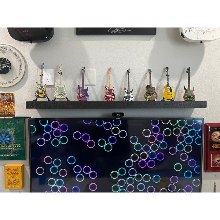 Eneas Pine Solid Wood Floating Shelf Millwood Pines Size: 2" H x 36" W x 6" D Finish: Black