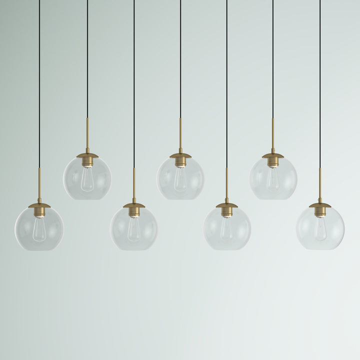 Jerricha 7 - Light Cluster Globe Pendant George Oliver Shade Color/Pattern: Clear Finish: Brass