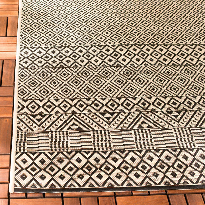 Arneshia Geometric Beige Indoor / Outdoor Area Rug Wade Logan® Rug Size: Rectangle 5'3" x 7'7"