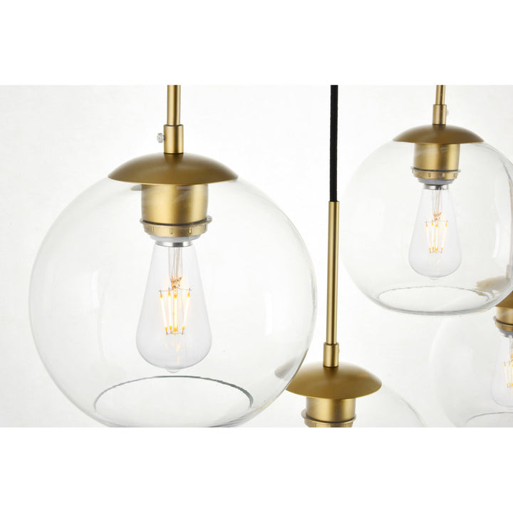 Jerricha 7 - Light Cluster Globe Pendant George Oliver Shade Color/Pattern: Clear Finish: Brass
