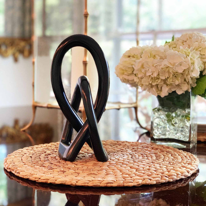 Jeffords Natural Soapstone Lovers Knot Sculpture Ivy Bronx Size: 10" H x 2.5" W x 2" D Finish: Black