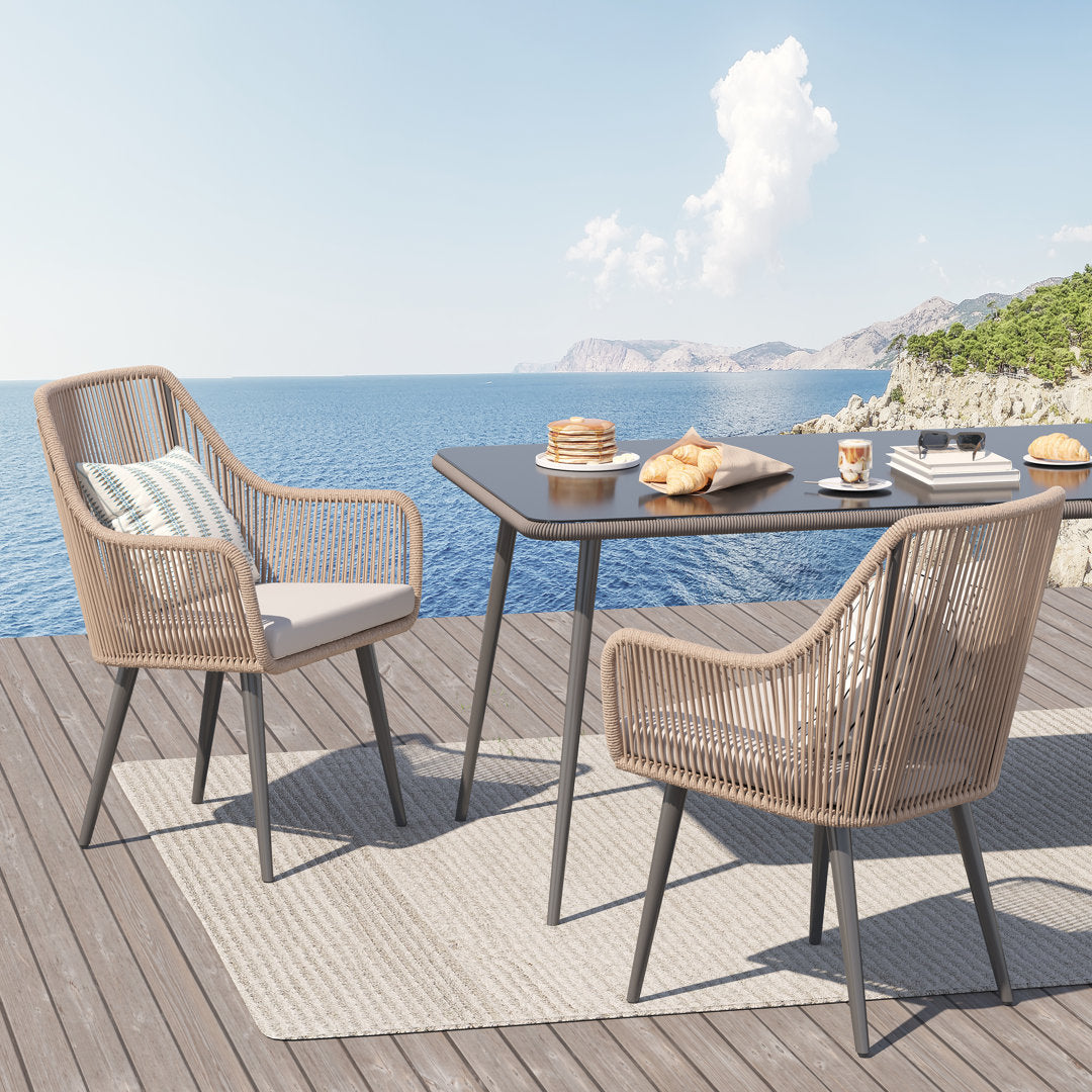 Cassil Patio Dining Armchair with Cushion (Set of 2) Wade Logan® Frame Color/Cushion Color: Beige Frame/Light Gray Cushion