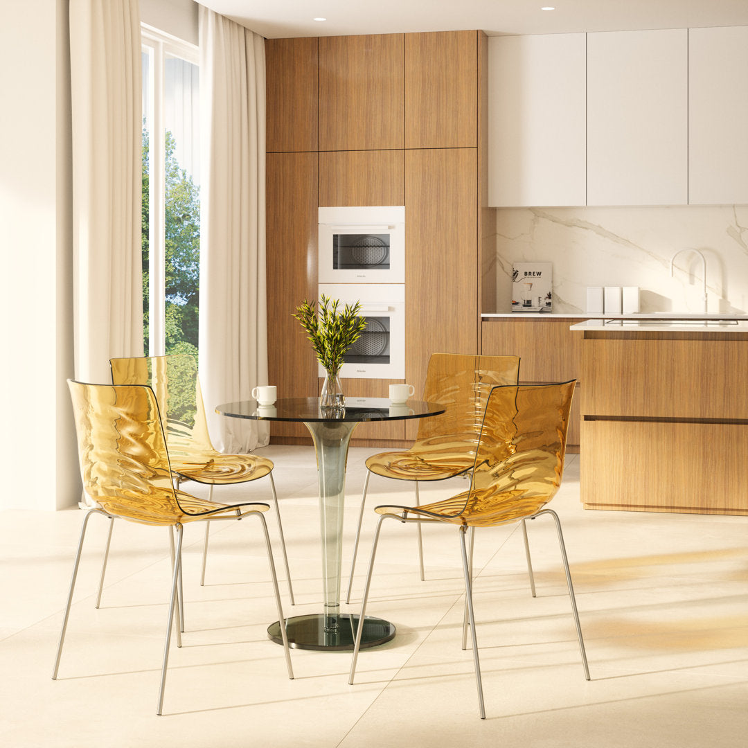 Lerner Plastic Dining Side Chair with Chrome Base Ivy Bronx Color: Transparent Orange