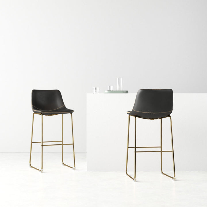 Nia Vegan Leather Bar & Counter Stool (Set of 2) AllModern Frame Color: Gold Upholstery: Black Vegan Leather, Seat Height: Bar Stool (29" Seat Height)