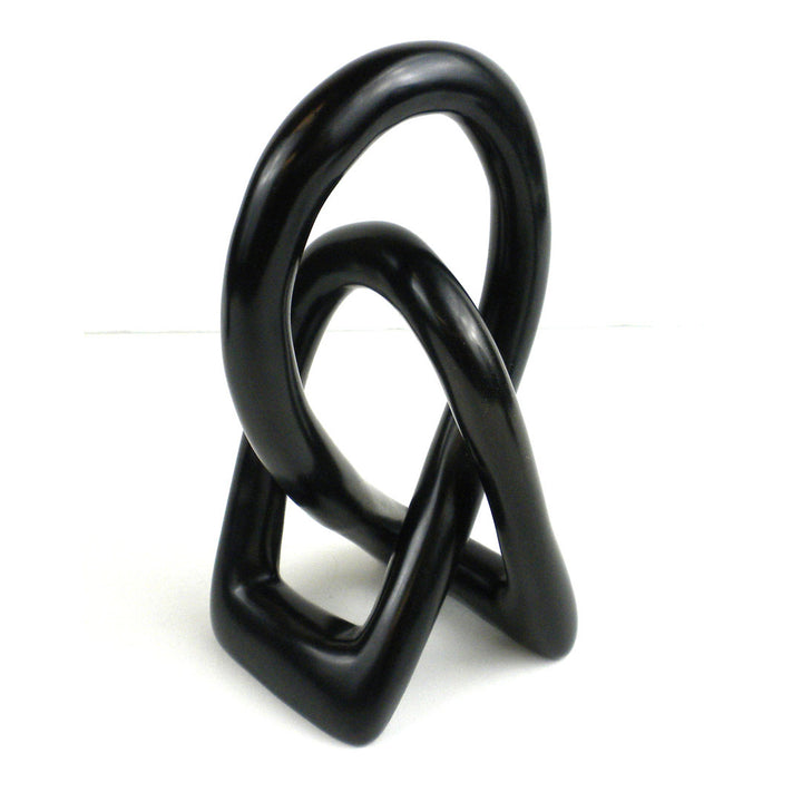 Jeffords Natural Soapstone Lovers Knot Sculpture Ivy Bronx Size: 6" H x 2.5" W x 2" D Finish: Black