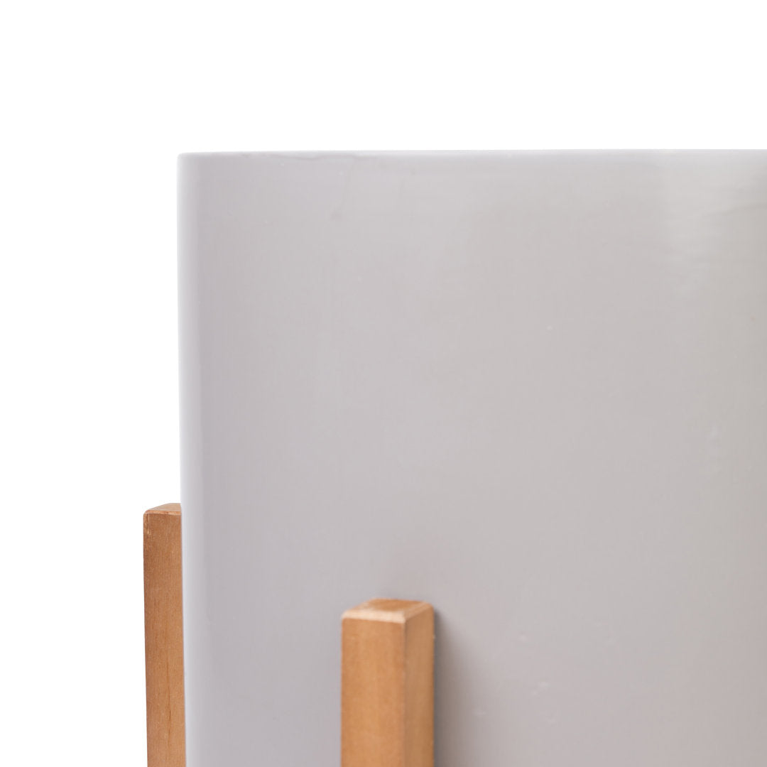 Surles Round Modern Ceramic Indoor Pot Planter with Wood Legs Mercury Row® Color: Gray Size: 13" H x 9" W x 9" D