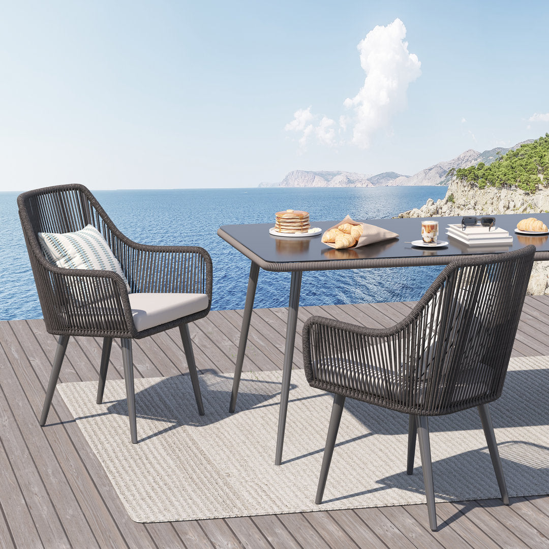 Cassil Patio Dining Armchair with Cushion (Set of 2) Wade Logan® Frame Color/Cushion Color: Black Frame/Light Gray Cushion