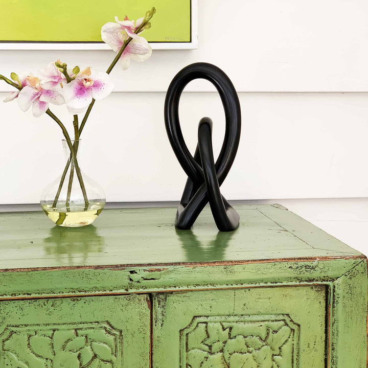 Jeffords Natural Soapstone Lovers Knot Sculpture Ivy Bronx Size: 6" H x 2.5" W x 2" D Finish: Black