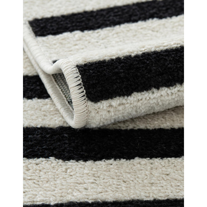Arzilla Striped Ivory/Black Area Rug Wade Logan® Rug Size: Rectangle 2'2" x 3'1"