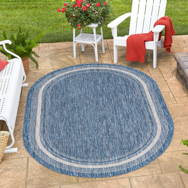 Swanee Blue Indoor / Outdoor Area Rug Arlmont & Co. Rug Size: Oval 7'10" x 10'