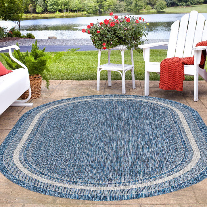 Swanee Blue Indoor / Outdoor Area Rug Arlmont & Co. Rug Size: Oval 7'10" x 10'